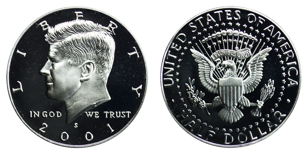 Grading strip showing four 2001 Kennedy half dollars from worn to gem uncirculated condition demonstrating the range of surface quality and luster